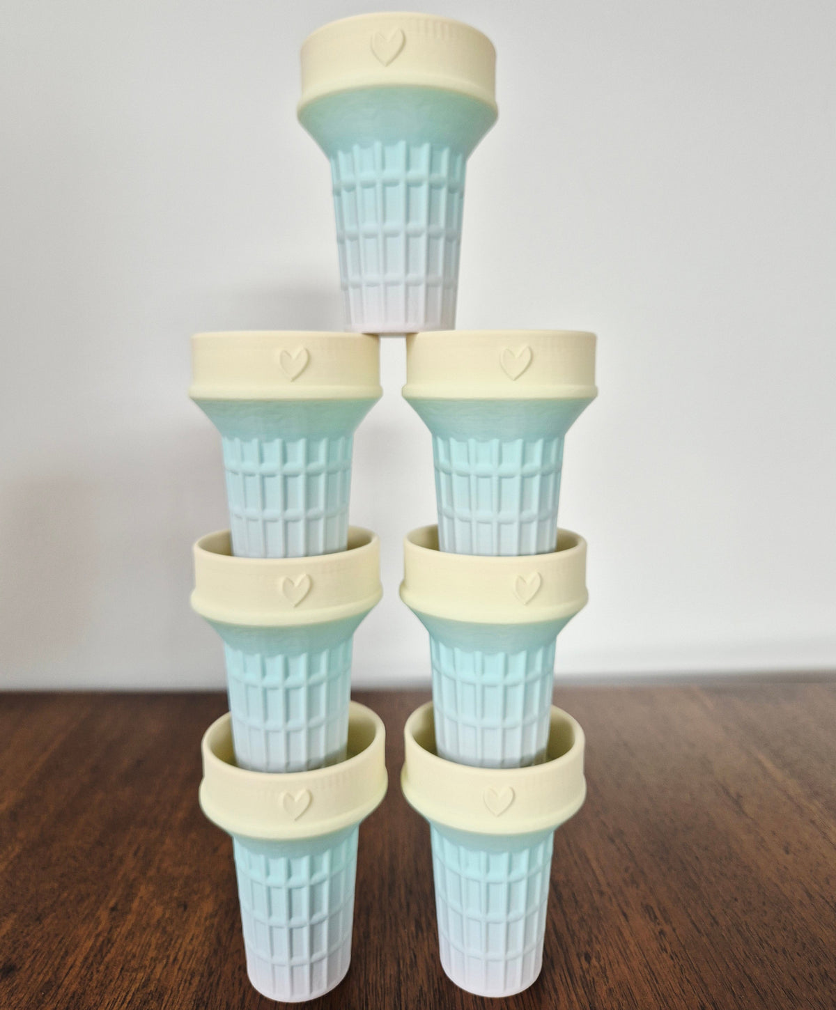 Pale rainbow coloured ice cream cone molds for sensory play