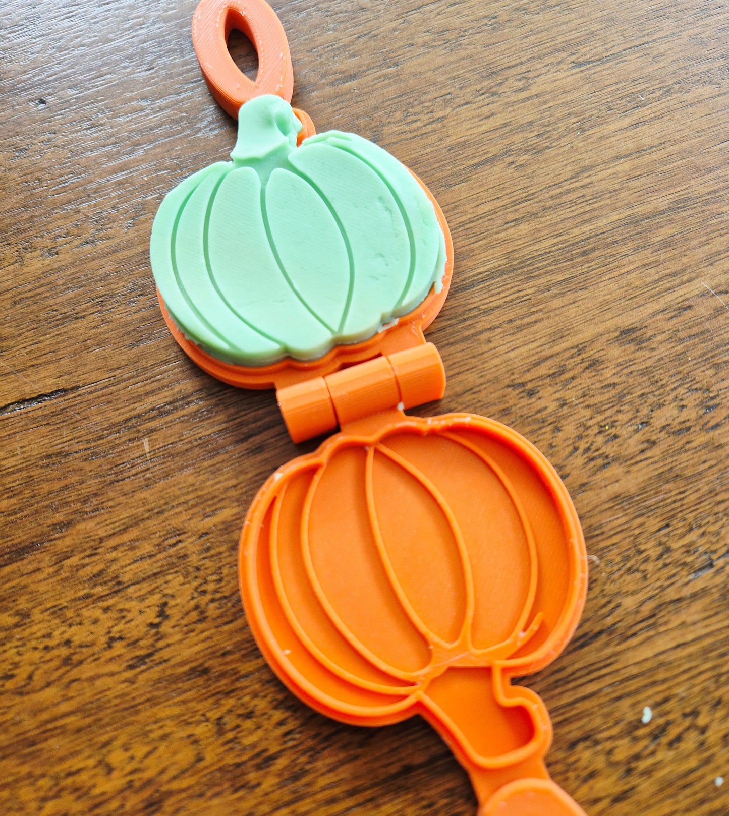 3D printed eco mold and press with a pumpkin design perfect for halloween playdough play and early learning.