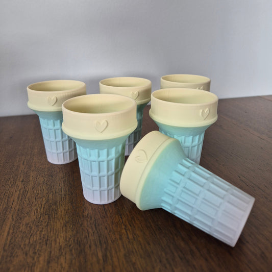 Pale rainbow coloured ice cream cone molds for sensory play