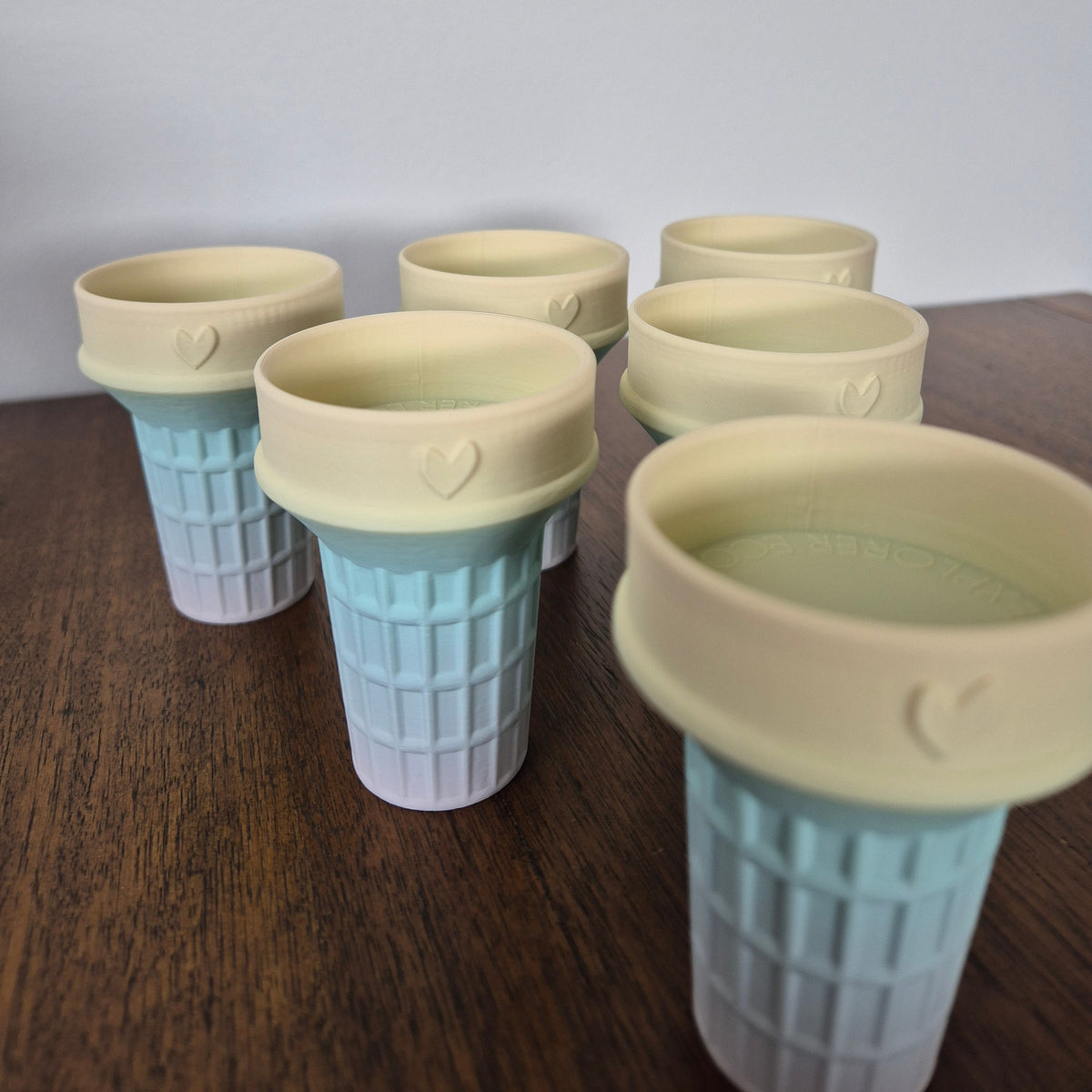 Pale rainbow coloured ice cream cone molds for sensory play