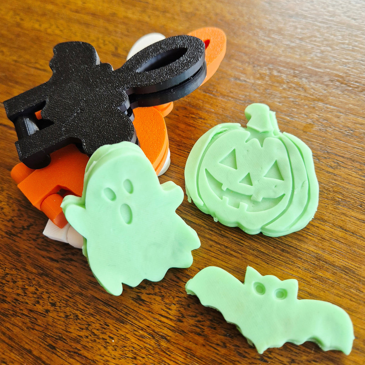 3D printed eco mold and press with a pumpkin design, bat design and ghost design perfect for halloween playdough play and early learning.